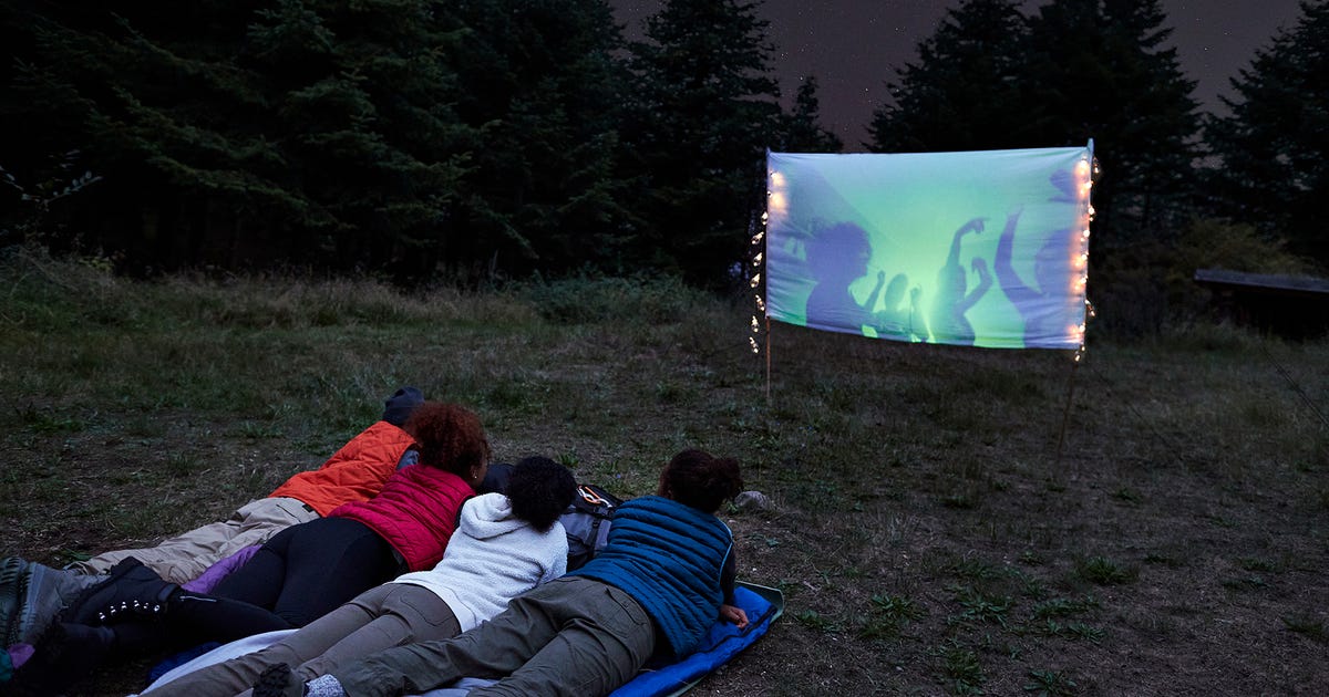 Backyard Movie Night: What You Need for Summer Cinema Under the Stars Transform your backyard into a theater with just a few pieces of gear. Some you might already have!